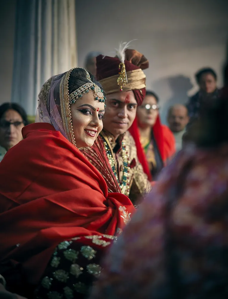 A wedding couple sharing a candid moment, in the Capture Film instant-film style