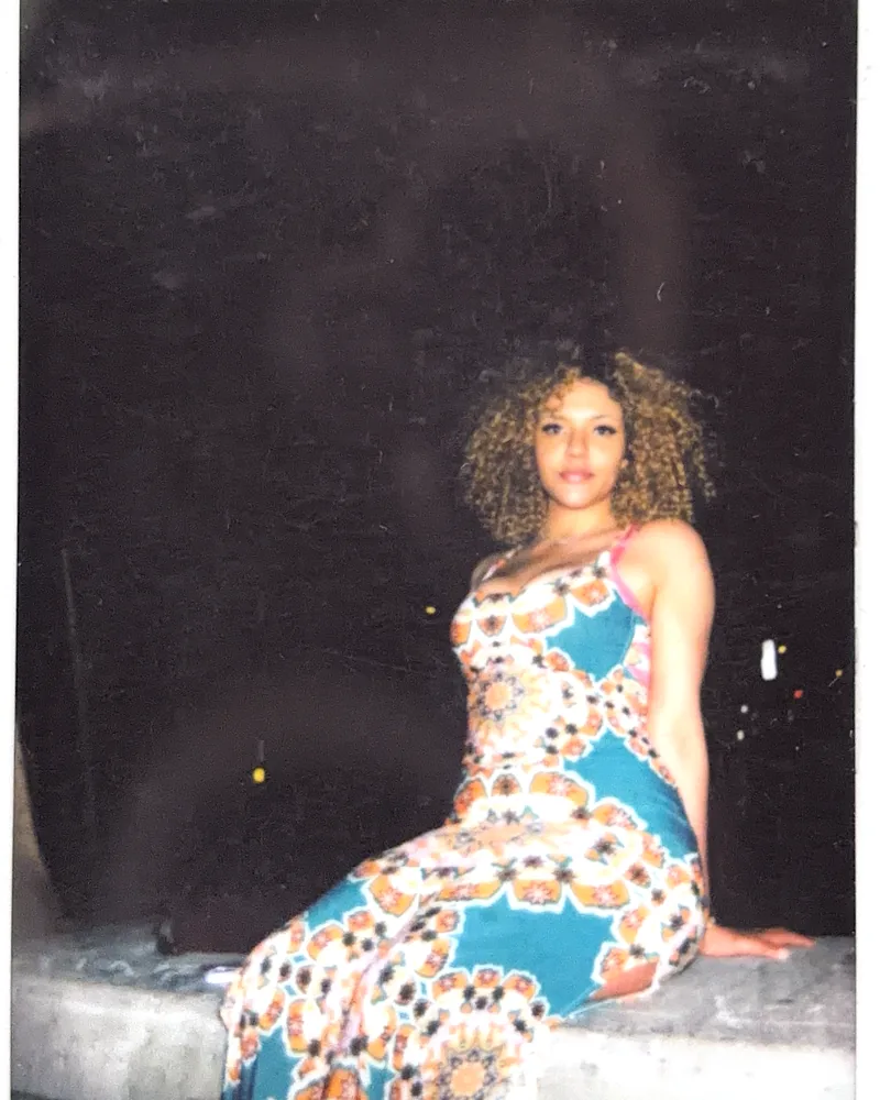 A candid evening portrait on instant film by Capture Film
