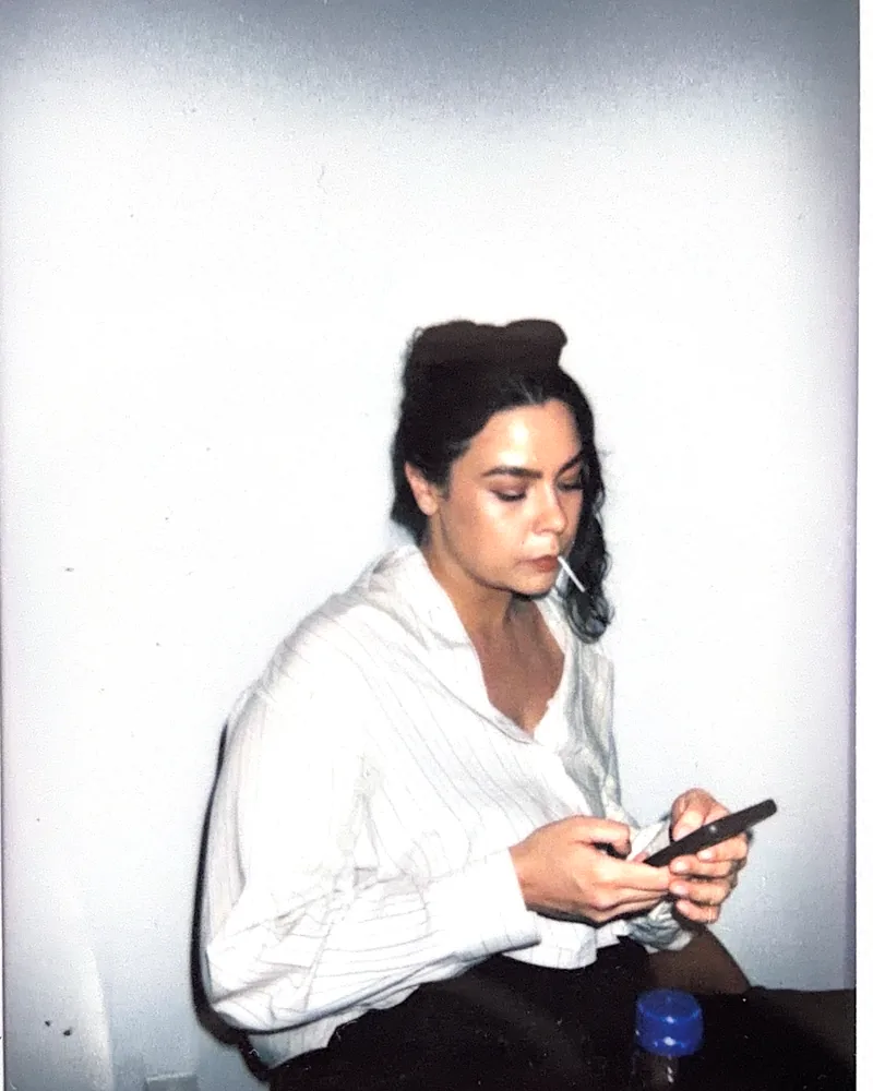 A relaxed editorial portrait on instant film by Capture Film