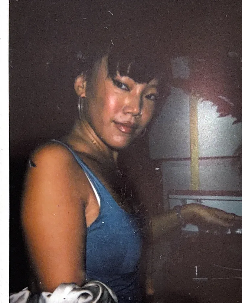 A candid nightlife portrait on instant film by Capture Film